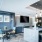 Luxury resident lounge with desks and chairs inside Rivermark Northern Liberties Apartments